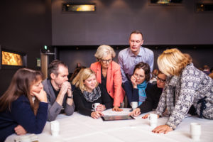 Specifique workshop of people working around table